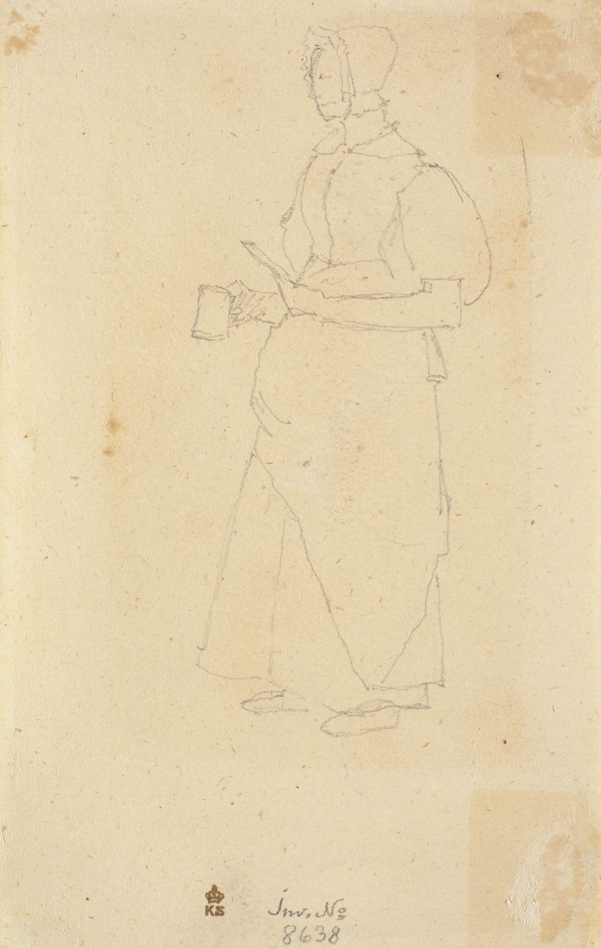 Stående kvinde med et krus i hånden